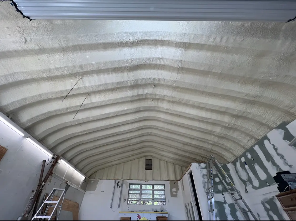 Spray polyurethane foam applied to the underside of a metal roof deck in Sierra Madre